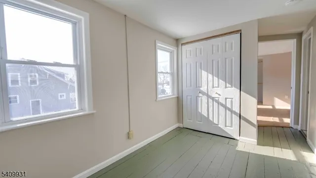 a view of a hallway with windows