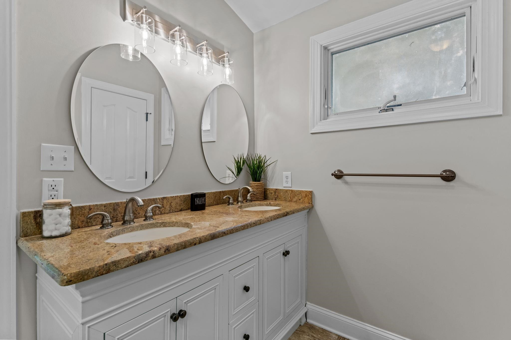 409 Husketh Road Youngsville, NC 27596 - Photo 14 of 29 a bathroom with a granite countertop sink and a mirror