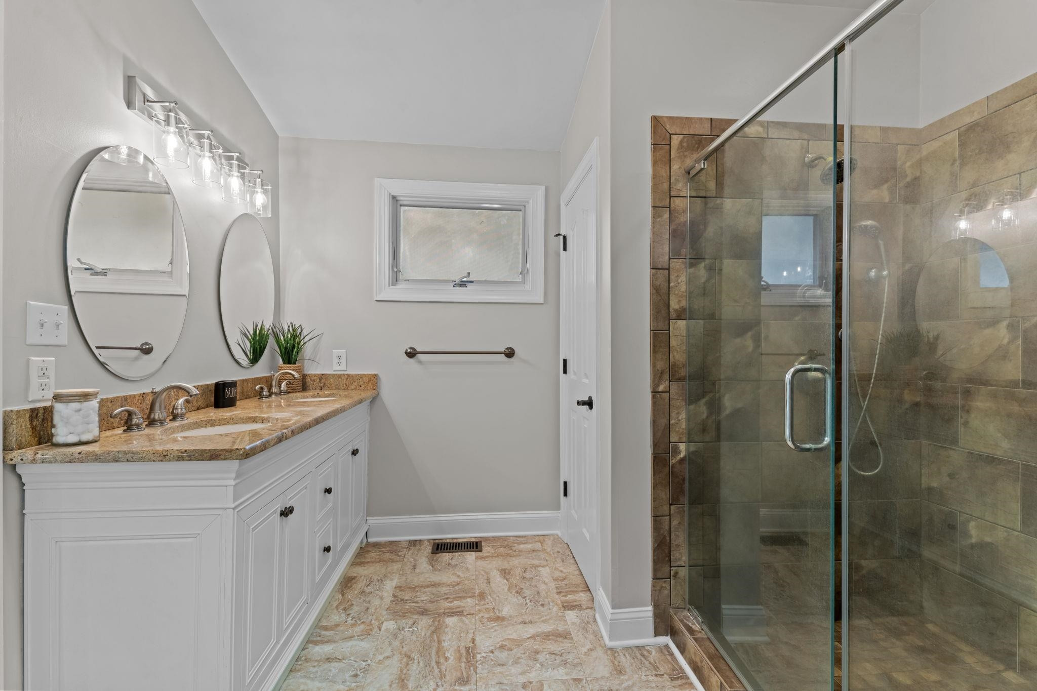 409 Husketh Road Youngsville, NC 27596 - Photo 15 of 29 a bathroom with a double vanity sink mirror and shower