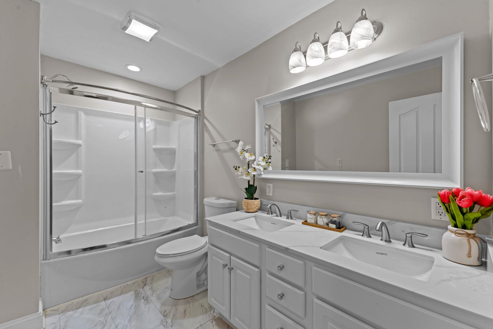 409 Husketh Road Youngsville, NC 27596 - Photo 19 of 29 a bathroom with a sink vanity granite toilet and shower