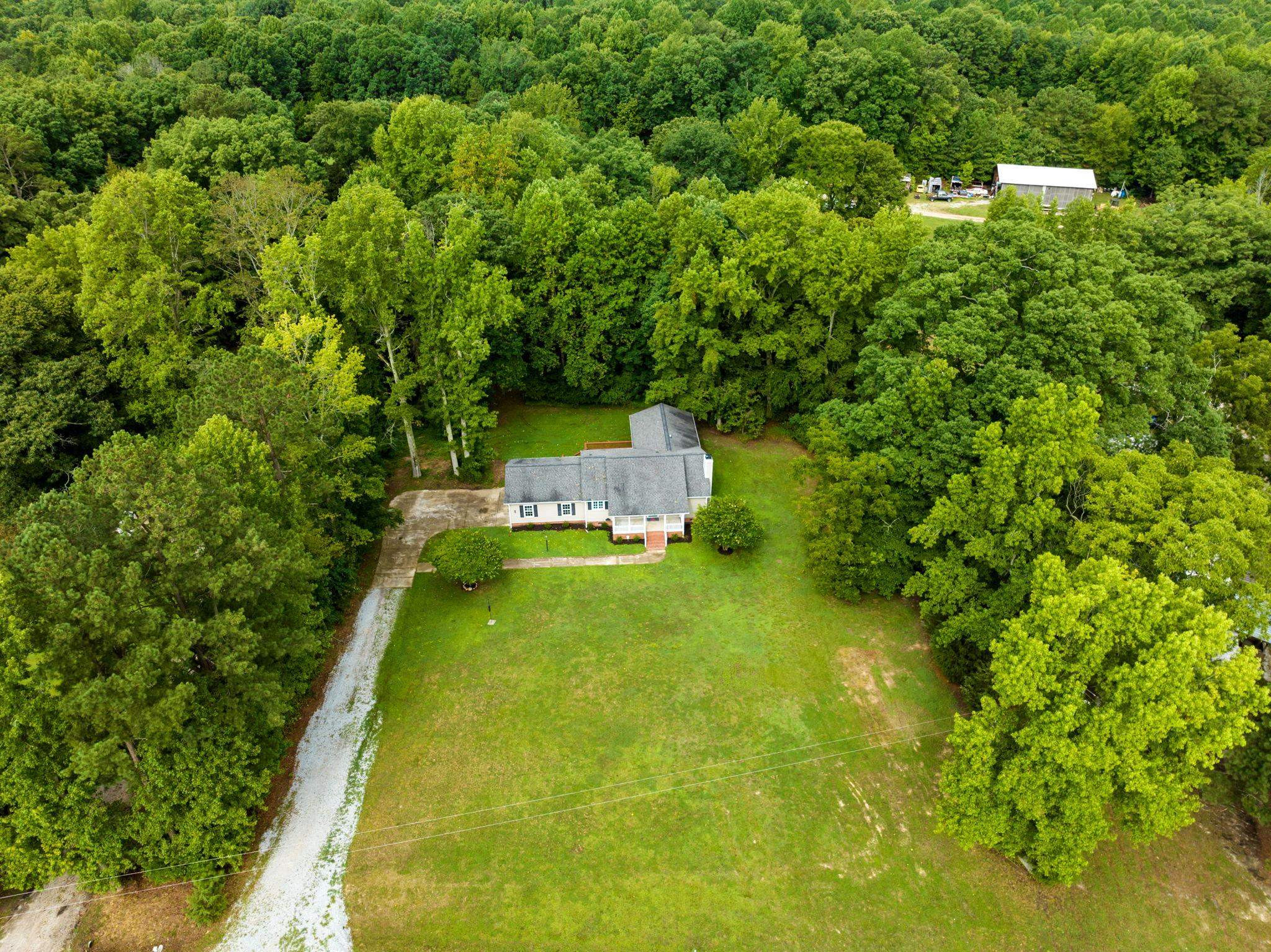 409 Husketh Road Youngsville, NC 27596 - Photo 2 of 29 a view of a yard with swimming pool