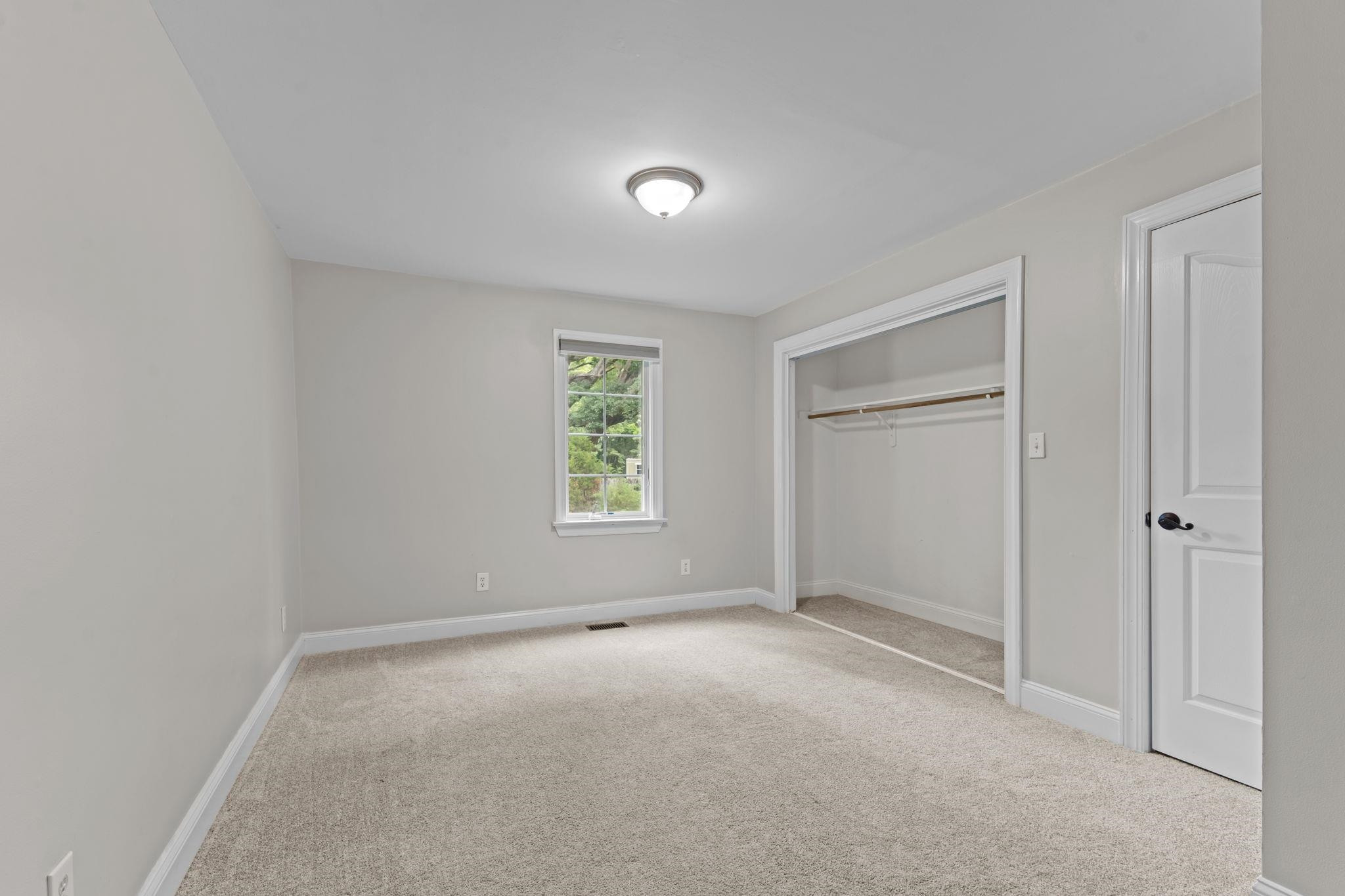 409 Husketh Road Youngsville, NC 27596 - Photo 22 of 29 a view of an empty room with a window