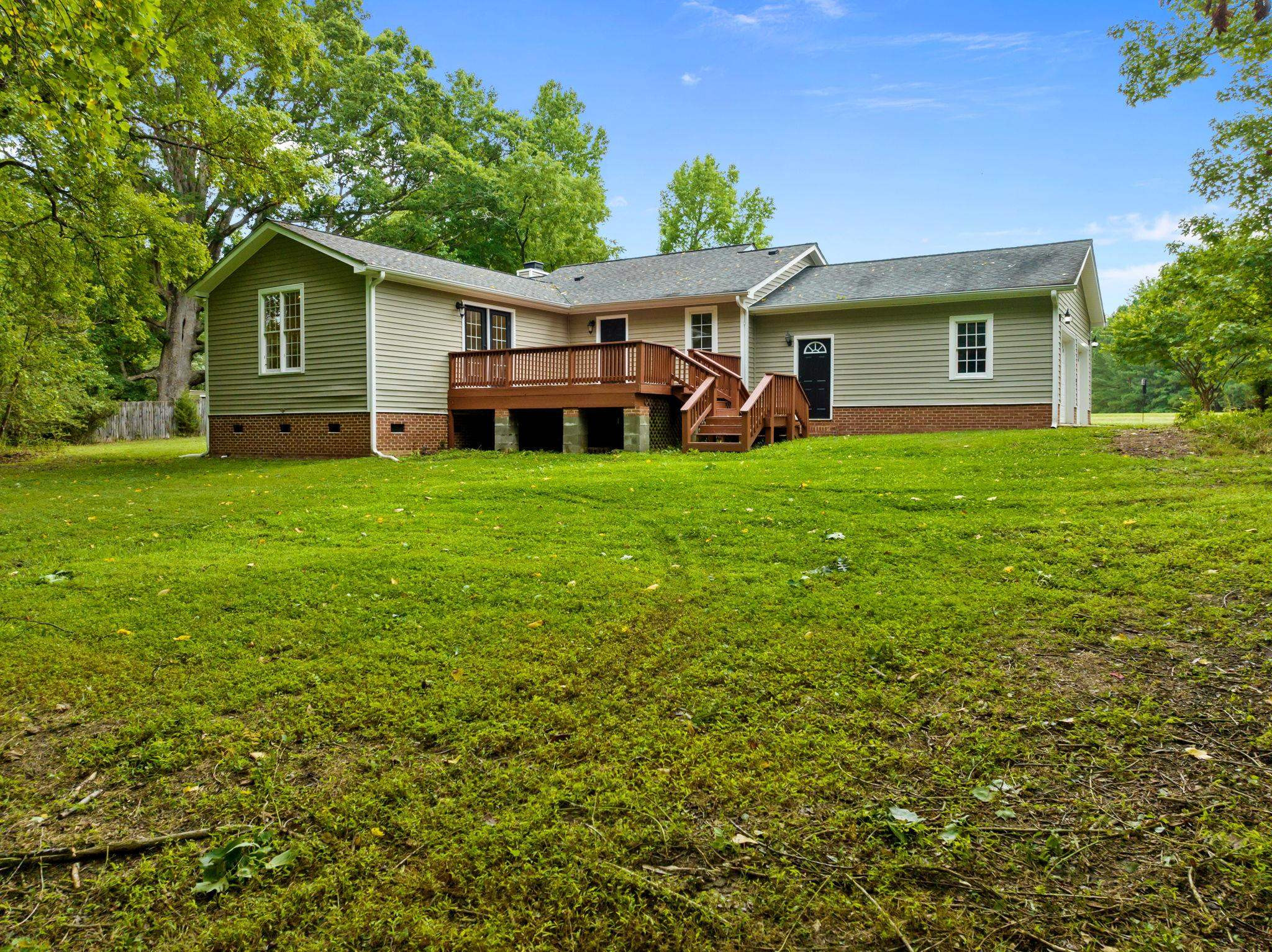409 Husketh Road Youngsville, NC 27596 - Photo 27 of 29 a front view of a house with a garden