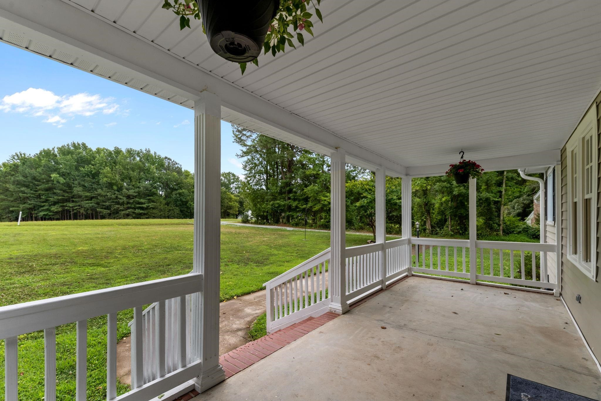 409 Husketh Road Youngsville, NC 27596 - Photo 3 of 29 a view of a porch with garden
