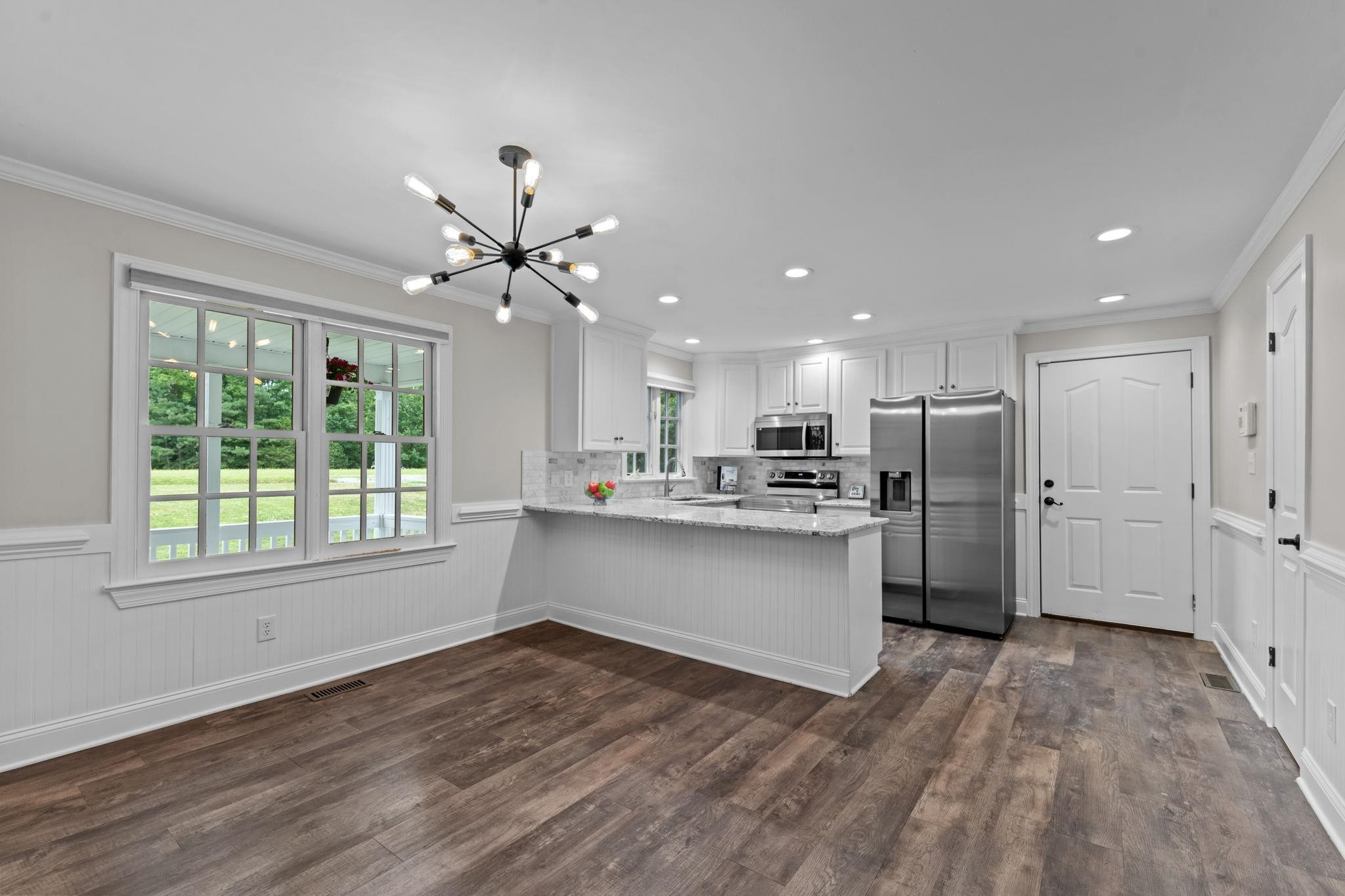 409 Husketh Road Youngsville, NC 27596 - Photo 7 of 29 a view of a kitchen with a sink and a window