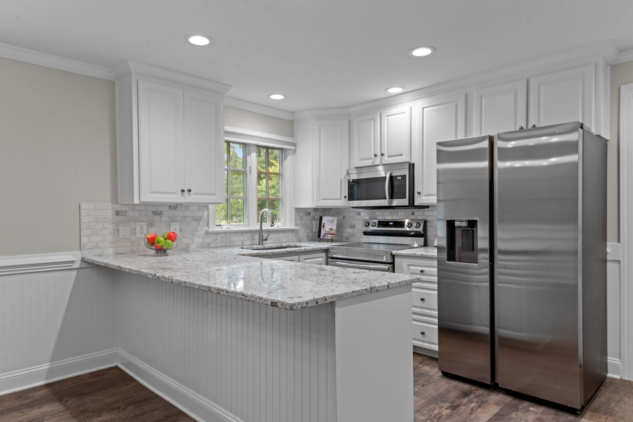409 Husketh Road Youngsville, NC 27596 - Photo 8 of 29 a kitchen with stainless steel appliances a refrigerator sink and microwave