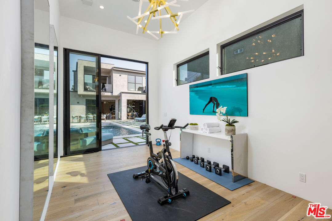 1371 Palms Boulevard Venice, CA 90291 - Photo 13 of 21 a room with gym equipment and a large window
