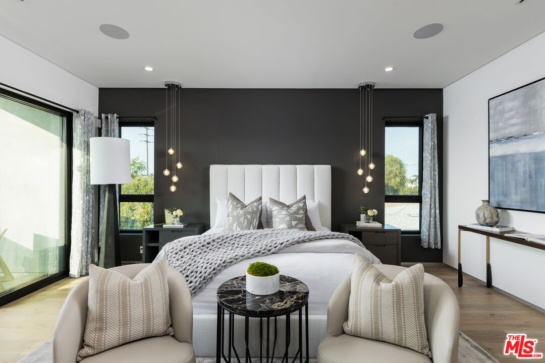 1371 Palms Boulevard Venice, CA 90291 - Photo 14 of 21 a bedroom with a bed and large mirror