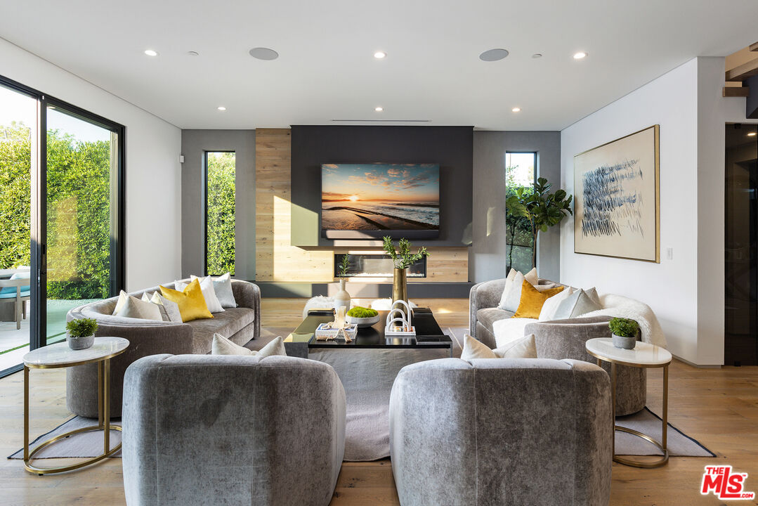 1371 Palms Boulevard Venice, CA 90291 - Photo 3 of 21 a living room with fireplace furniture and a large window