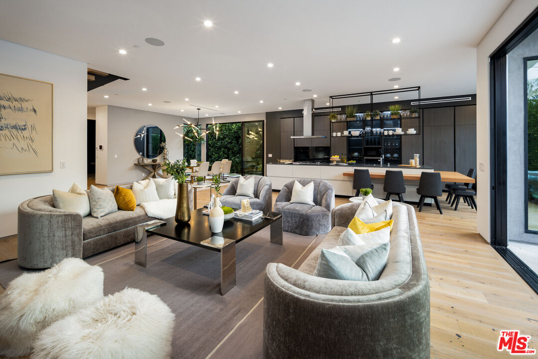 1371 Palms Boulevard Venice, CA 90291 - Photo 4 of 21 a living room with furniture and a view of kitchen