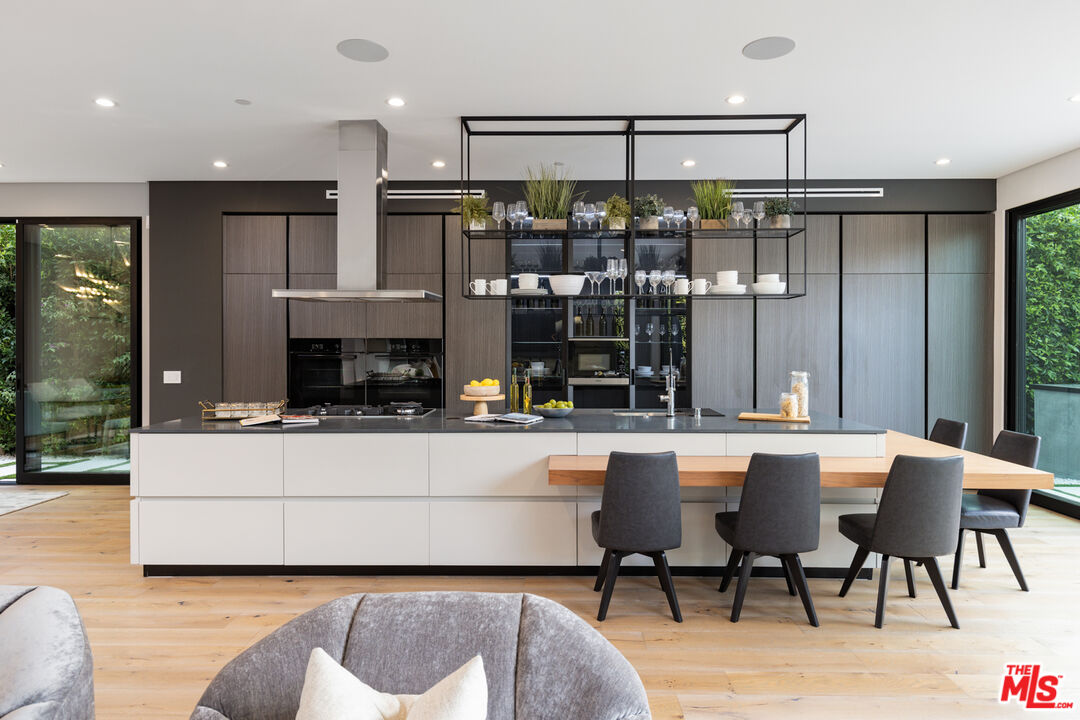 1371 Palms Boulevard Venice, CA 90291 - Photo 5 of 21 a living room with stainless steel appliances kitchen island granite countertop furniture and a fireplace