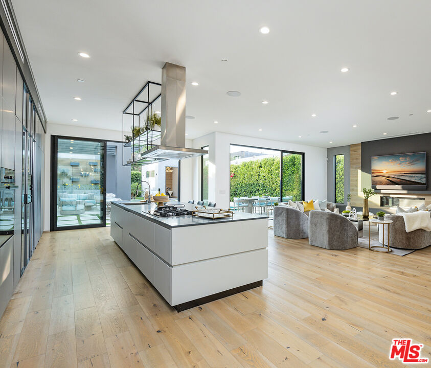 1371 Palms Boulevard Venice, CA 90291 - Photo 6 of 21 a living room with stainless steel appliances kitchen island hardwood floor and a large window