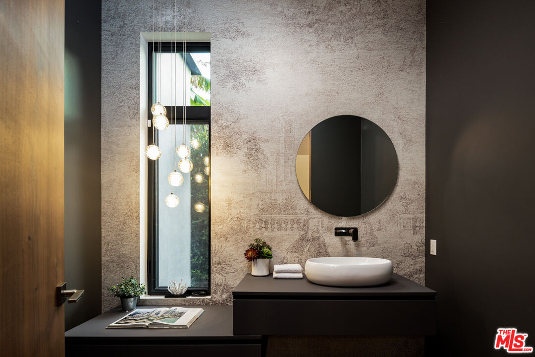 1371 Palms Boulevard Venice, CA 90291 - Photo 8 of 21 a bathroom with a sink and a mirror