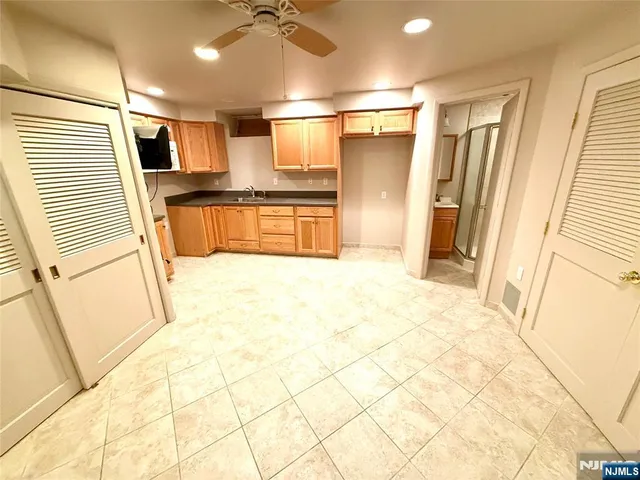 a view of a refrigerator in kitchen and wooden floor