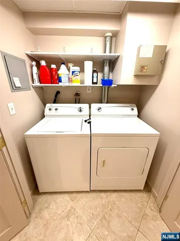 a living room with a table chairs and a wooden floor