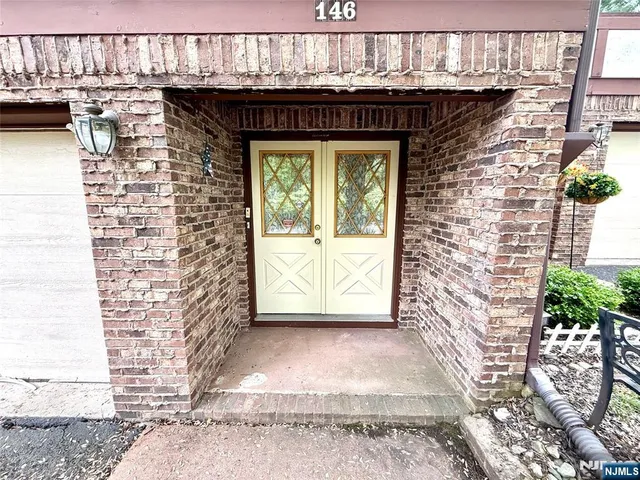 a front view of a house with a outdoor space