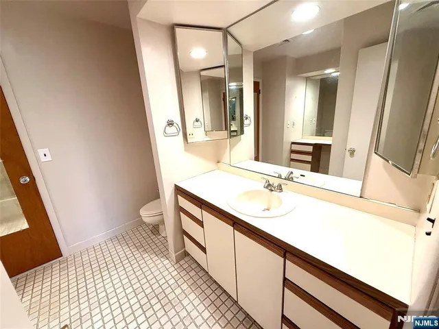 a balcony with wooden floor and trees