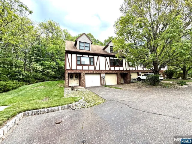a view of a pathway with a yard