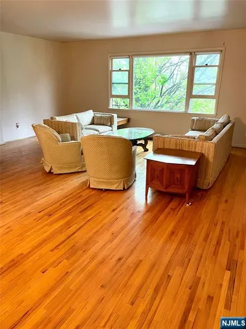 a living room with a couch and large windows