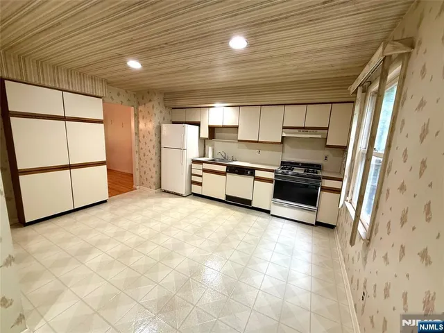 a view of kitchen with furniture and window