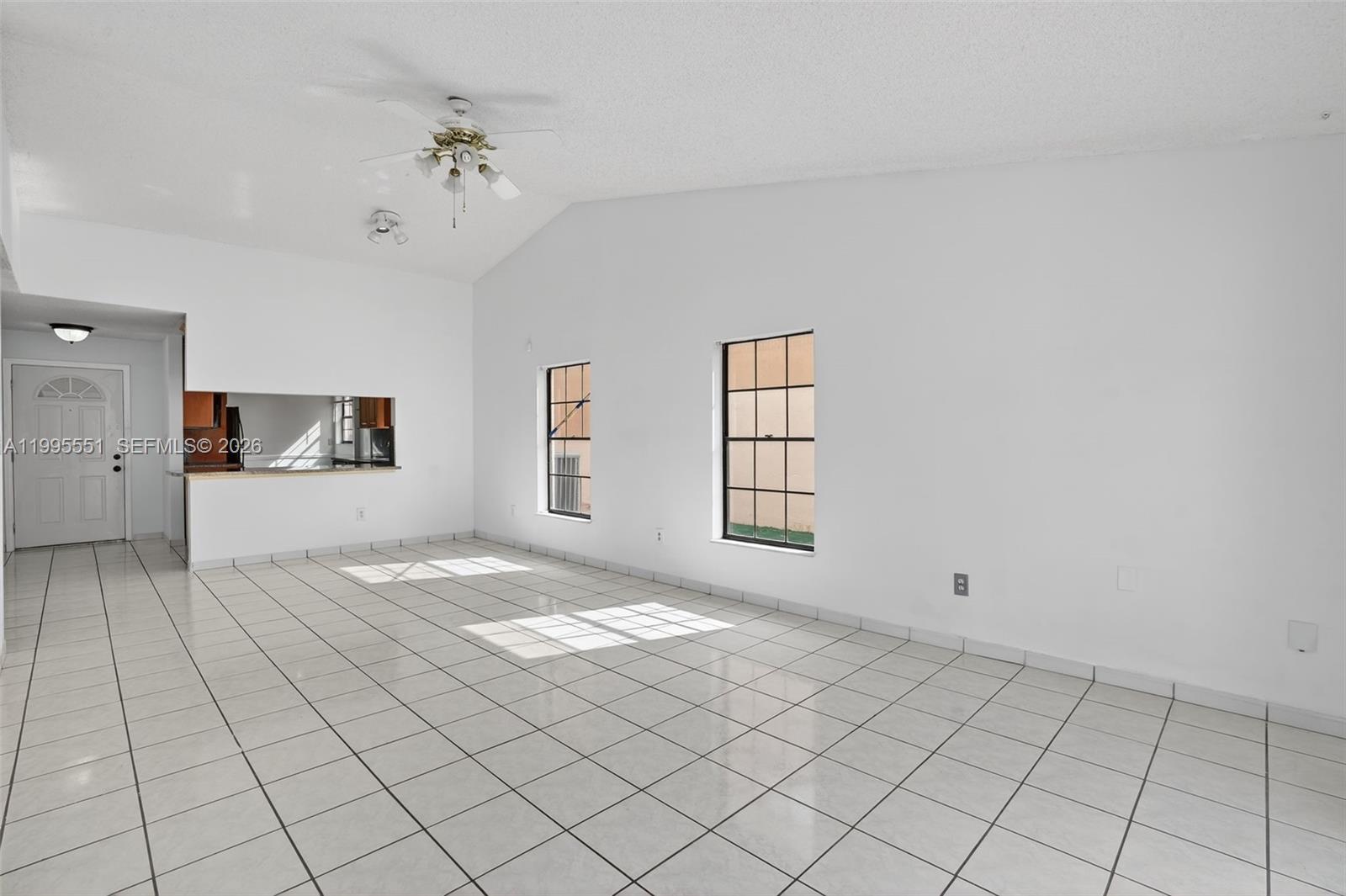 14722 Southwest 110th Terrace Miami, FL 33196 - Photo 13 of 37 a view of an empty room with a window