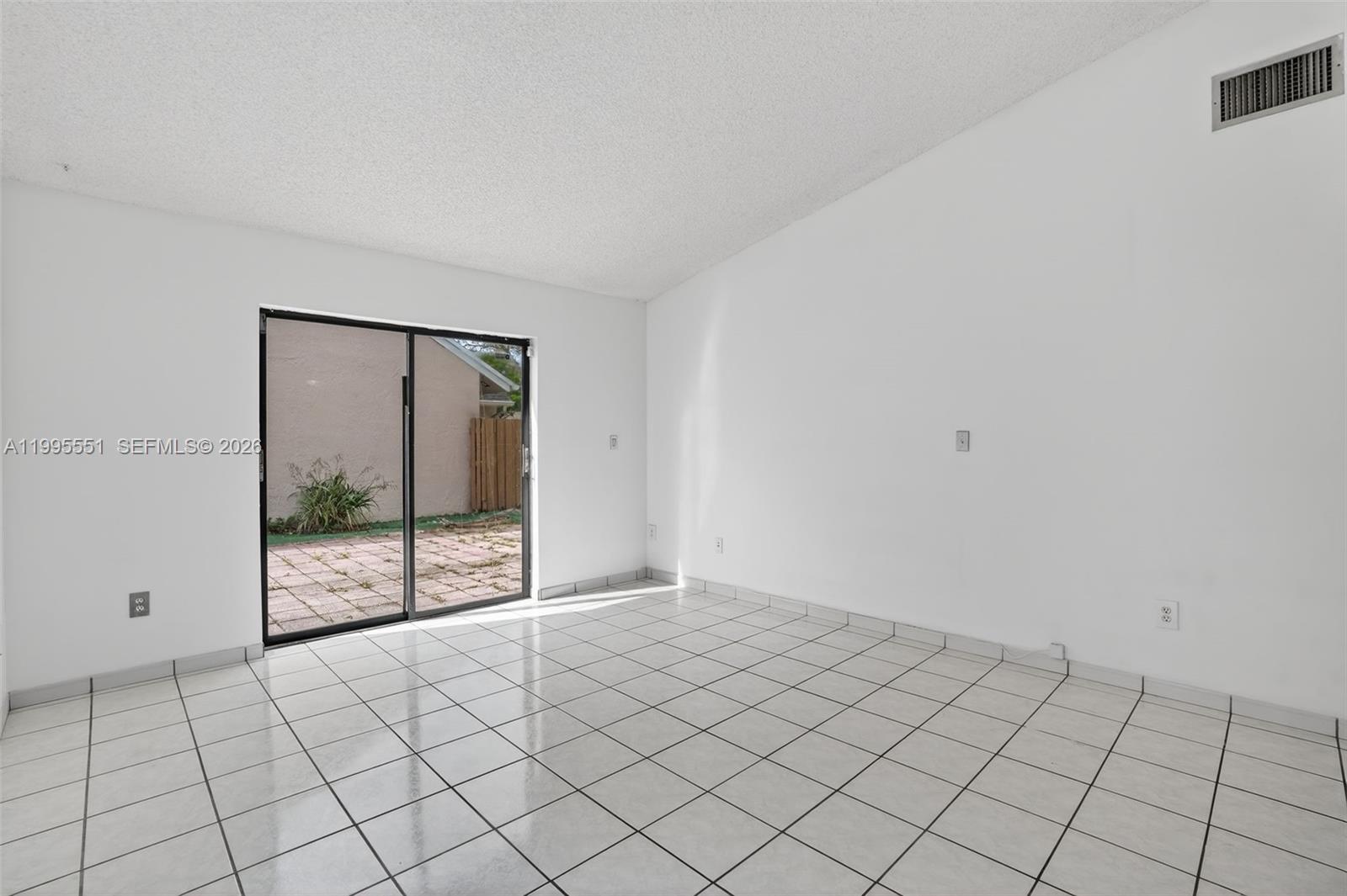 14722 Southwest 110th Terrace Miami, FL 33196 - Photo 14 of 37 a view of an empty room and window