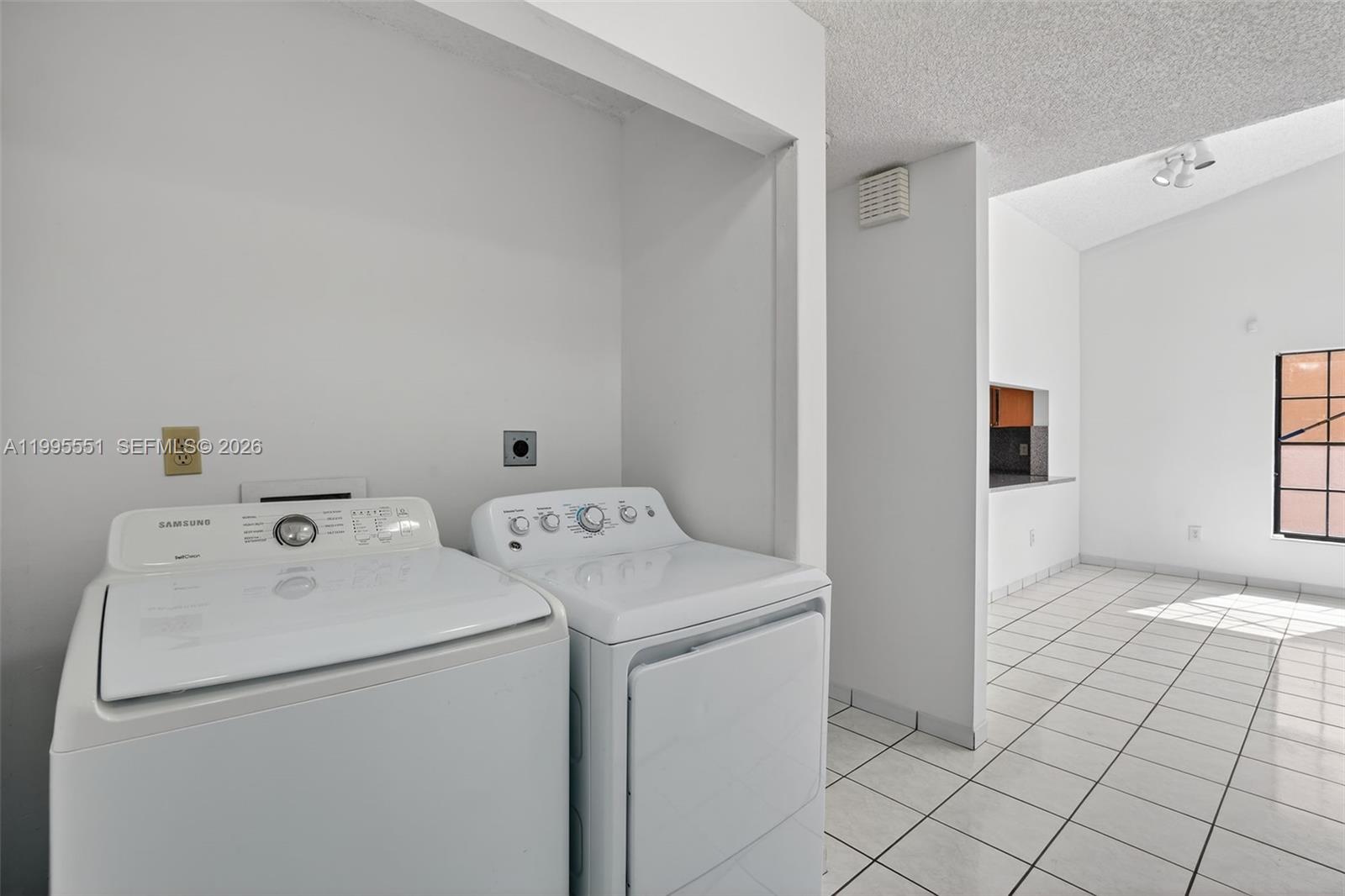 14722 Southwest 110th Terrace Miami, FL 33196 - Photo 17 of 37 a utility room with dryer and washer