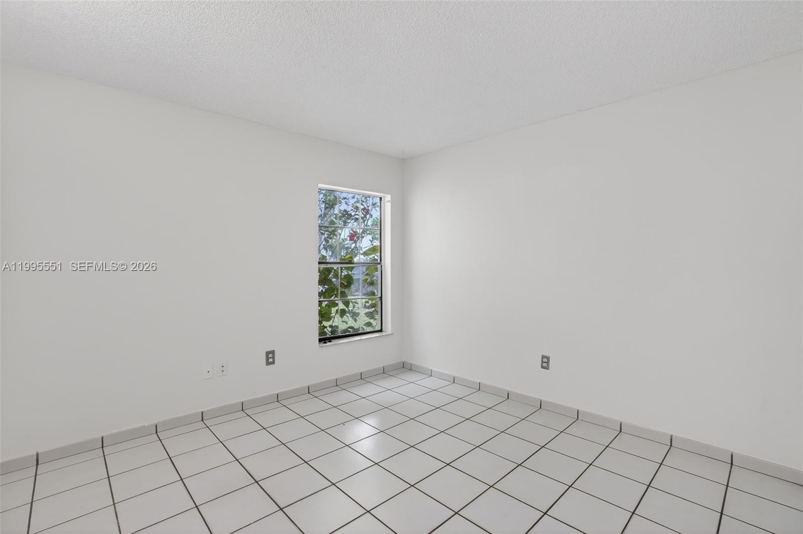 14722 Southwest 110th Terrace Miami, FL 33196 - Photo 18 of 37 a view of an empty room and window