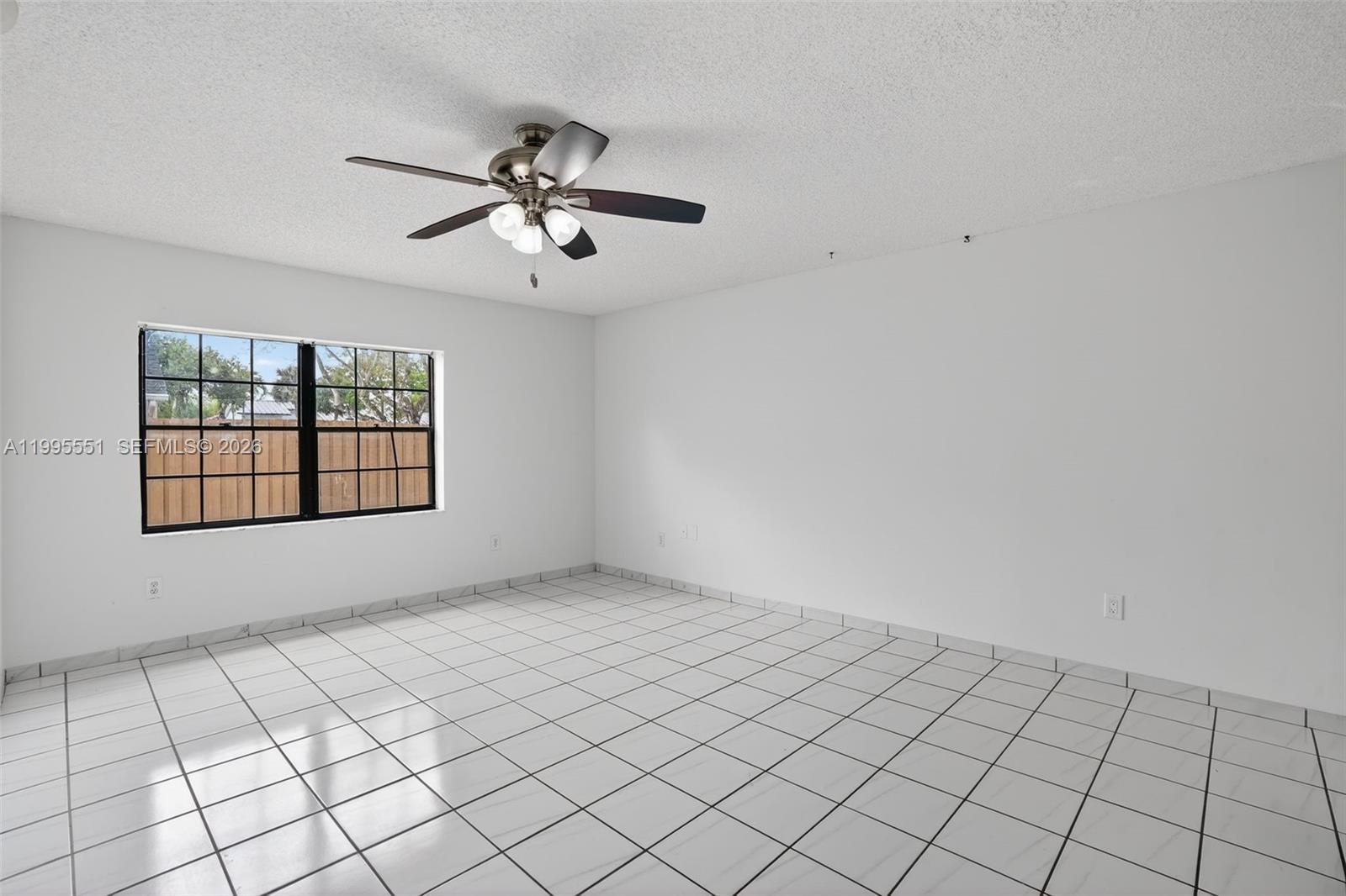 14722 Southwest 110th Terrace Miami, FL 33196 - Photo 22 of 37 a view of an empty room and window