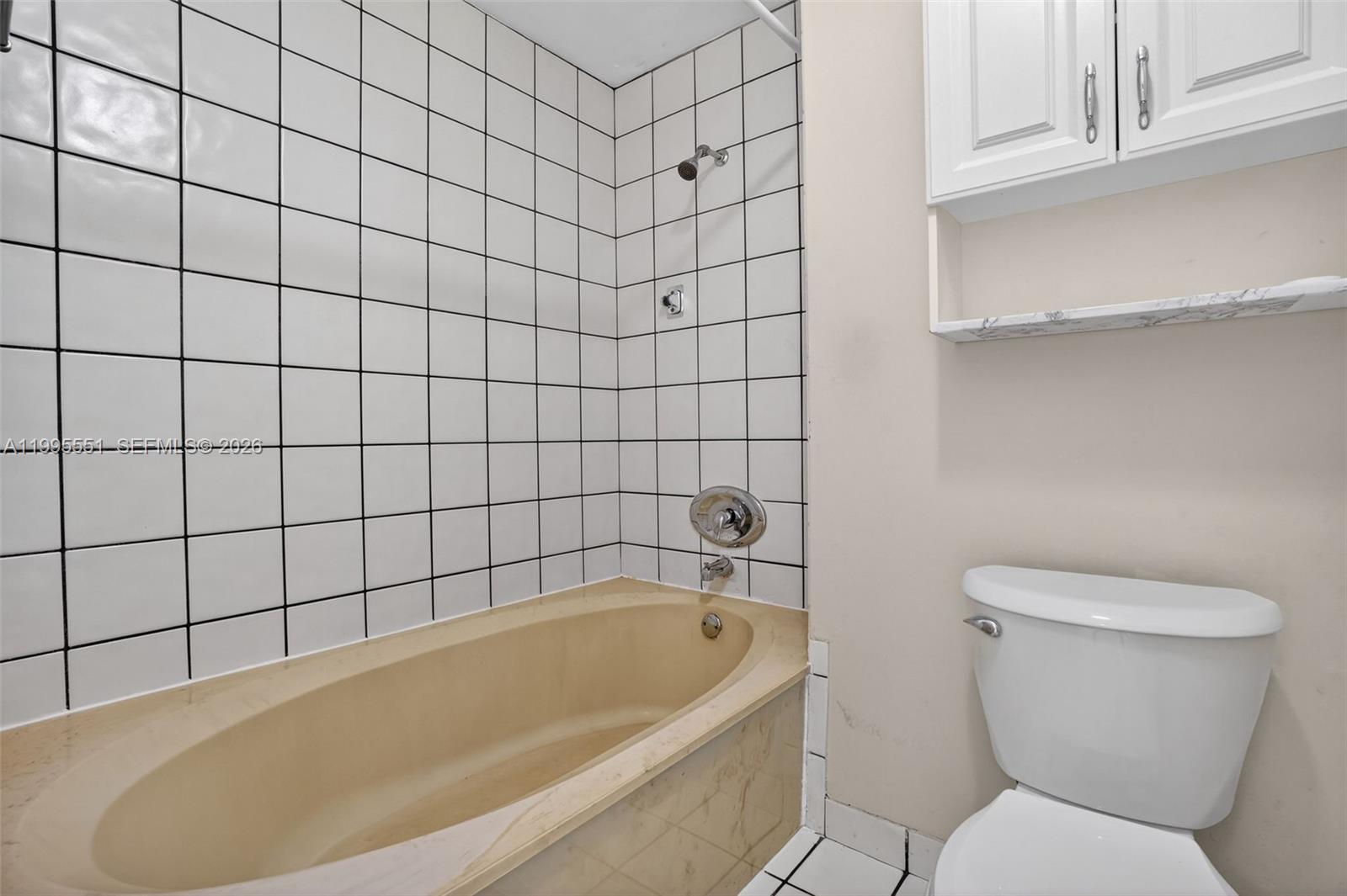 14722 Southwest 110th Terrace Miami, FL 33196 - Photo 26 of 37 a bathroom with a bathtub and toilet