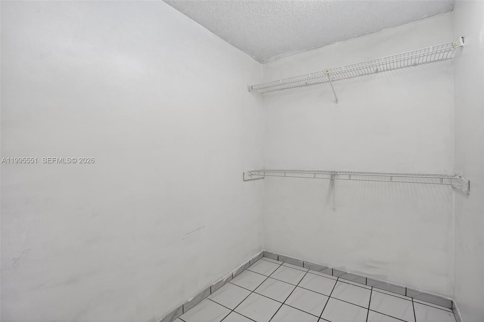 14722 Southwest 110th Terrace Miami, FL 33196 - Photo 27 of 37 a view of an empty walk in closet