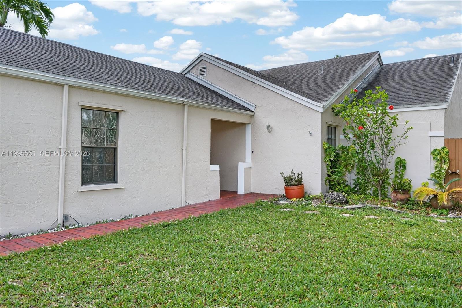 14722 Southwest 110th Terrace Miami, FL 33196 - Photo 3 of 37 a front view of house with yard