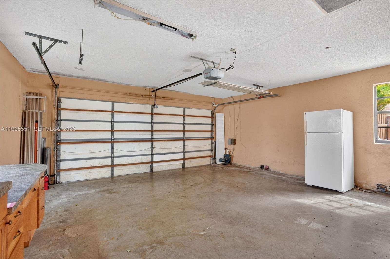 14722 Southwest 110th Terrace Miami, FL 33196 - Photo 31 of 37 a view of a livingroom with closet and cabinet