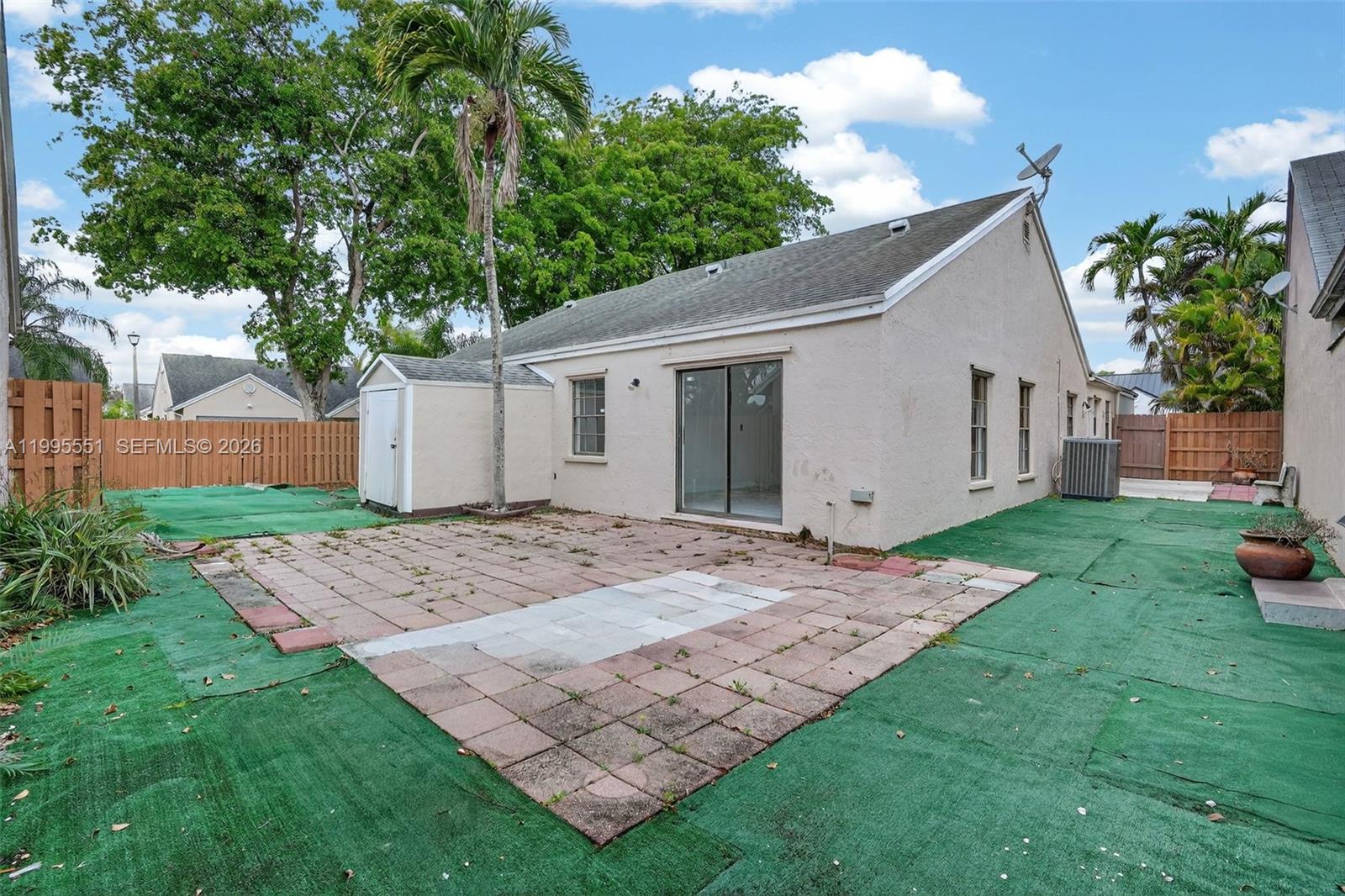 14722 Southwest 110th Terrace Miami, FL 33196 - Photo 33 of 37 a view of a house with a yard and chair