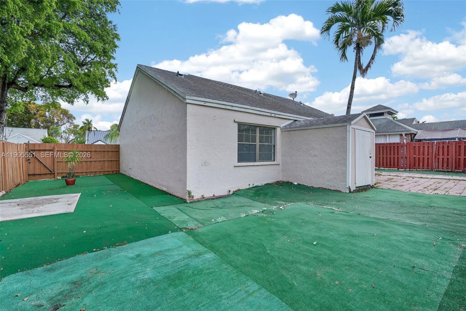 14722 Southwest 110th Terrace Miami, FL 33196 - Photo 34 of 37 a backyard of a house with lots of green space