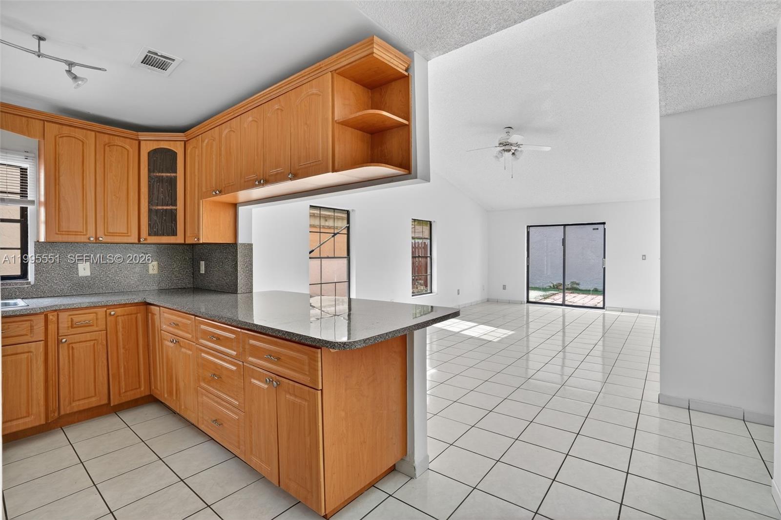 14722 Southwest 110th Terrace Miami, FL 33196 - Photo 5 of 37 a kitchen with stainless steel appliances granite countertop a sink and cabinets