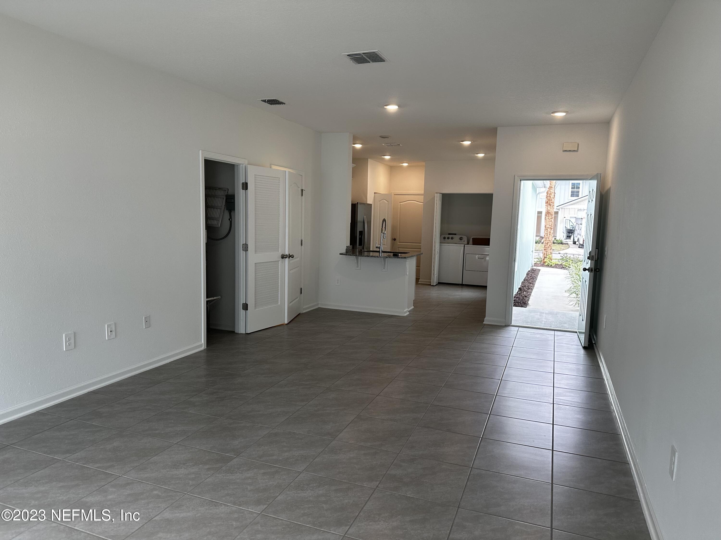 400 Talulla Trail St. Augustine, FL 32095 - Photo 16 of 58 a view of a living room a refrigerator and a couch