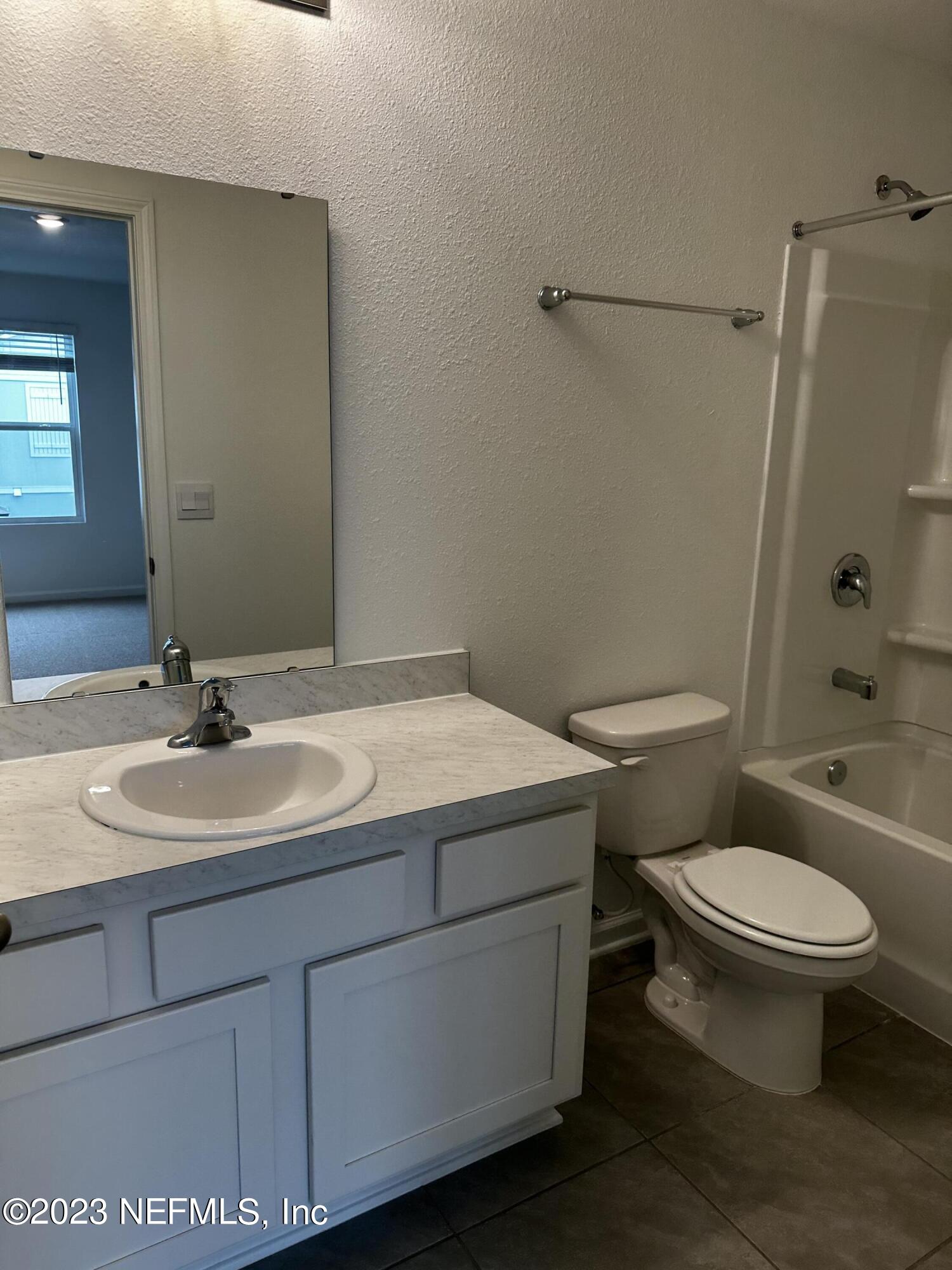 400 Talulla Trail St. Augustine, FL 32095 - Photo 40 of 58 a bathroom with a sink toilet and shower
