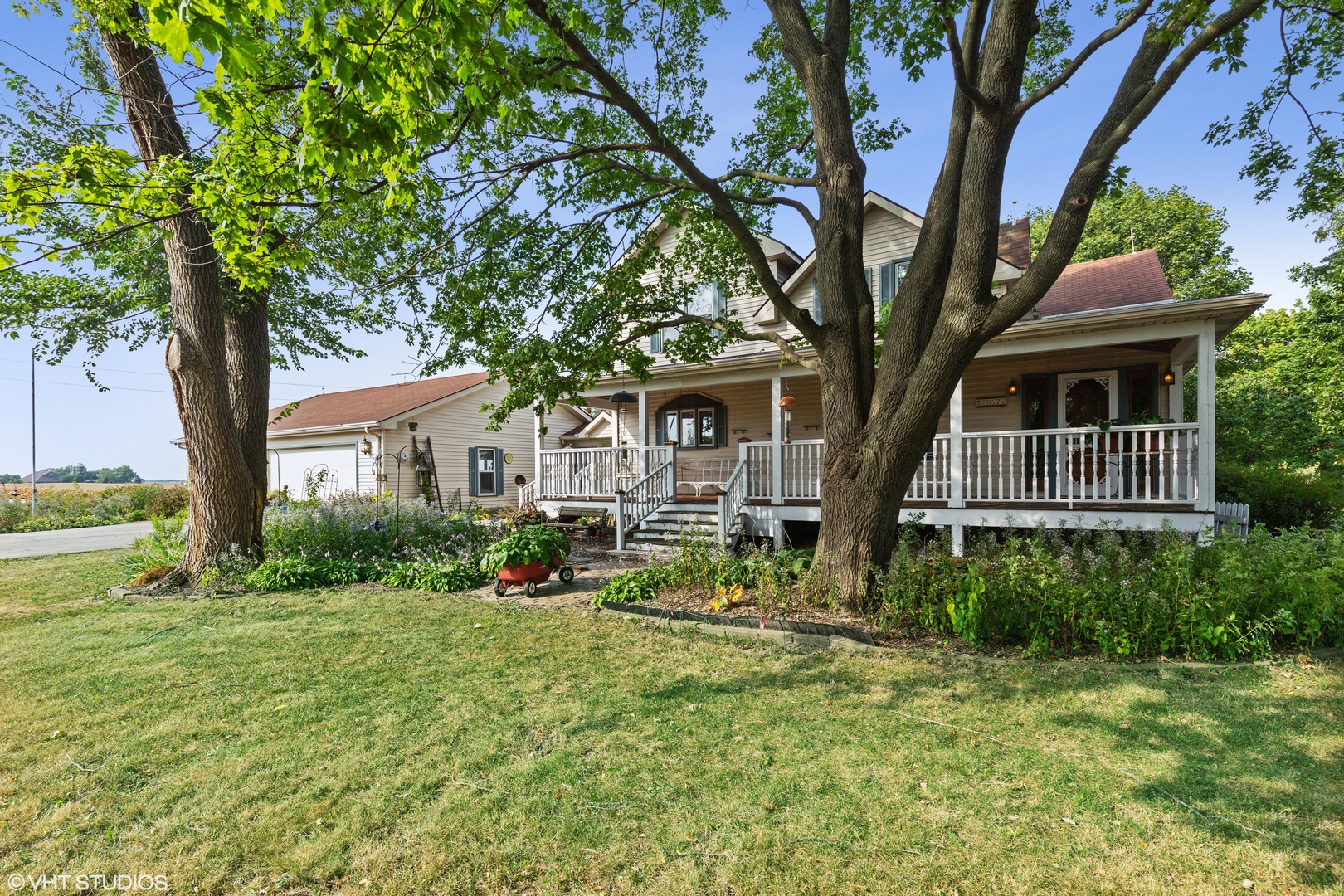 28573 Moose Range Road Sycamore, IL 60178 - Photo 14 of 52 a front view of a house with garden
