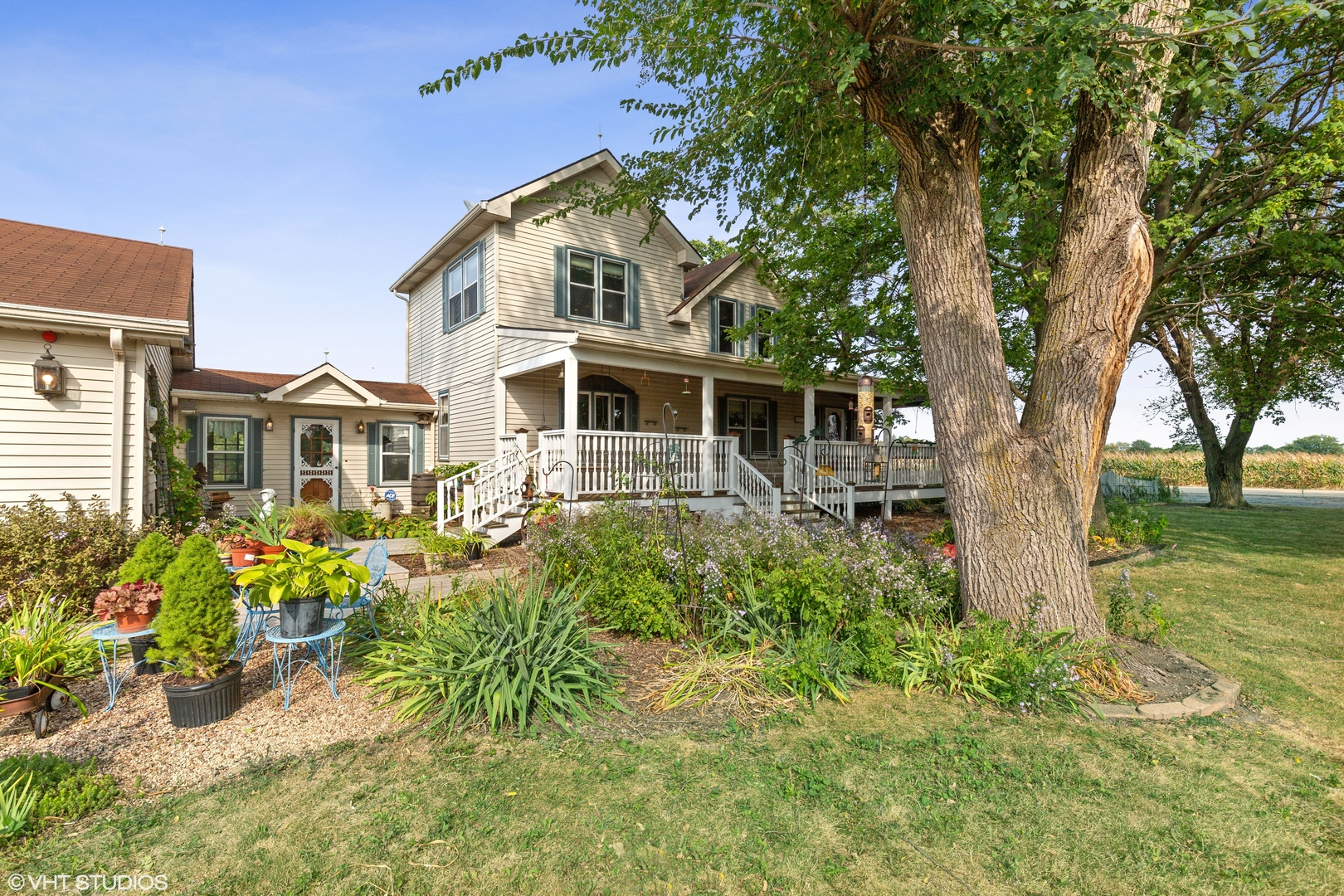 28573 Moose Range Road Sycamore, IL 60178 - Photo 16 of 52 a front view of a house with garden