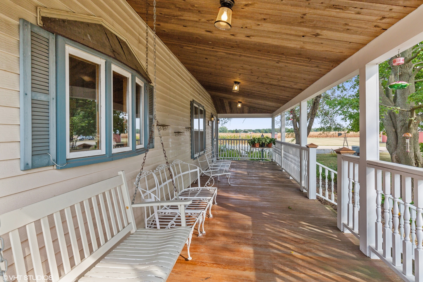 28573 Moose Range Road Sycamore, IL 60178 - Photo 20 of 52 a view of a porch with wooden floor and iron stairs