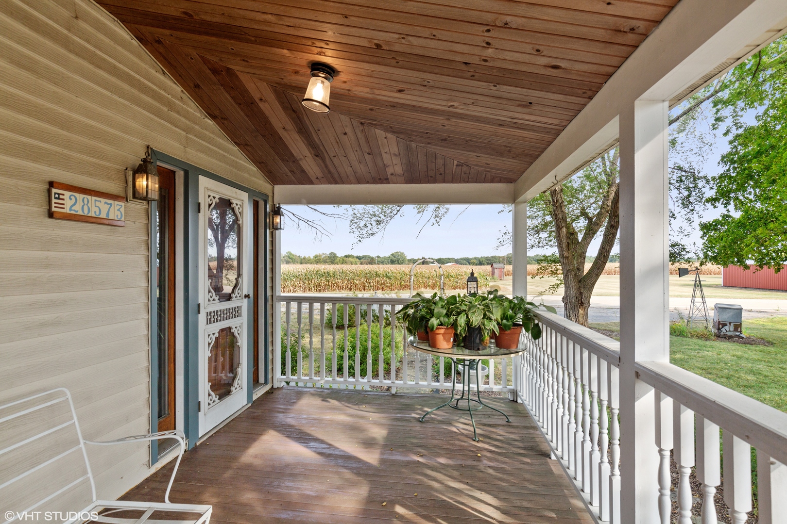 28573 Moose Range Road Sycamore, IL 60178 - Photo 21 of 52 a view of a porch with wooden floor outdoor seating