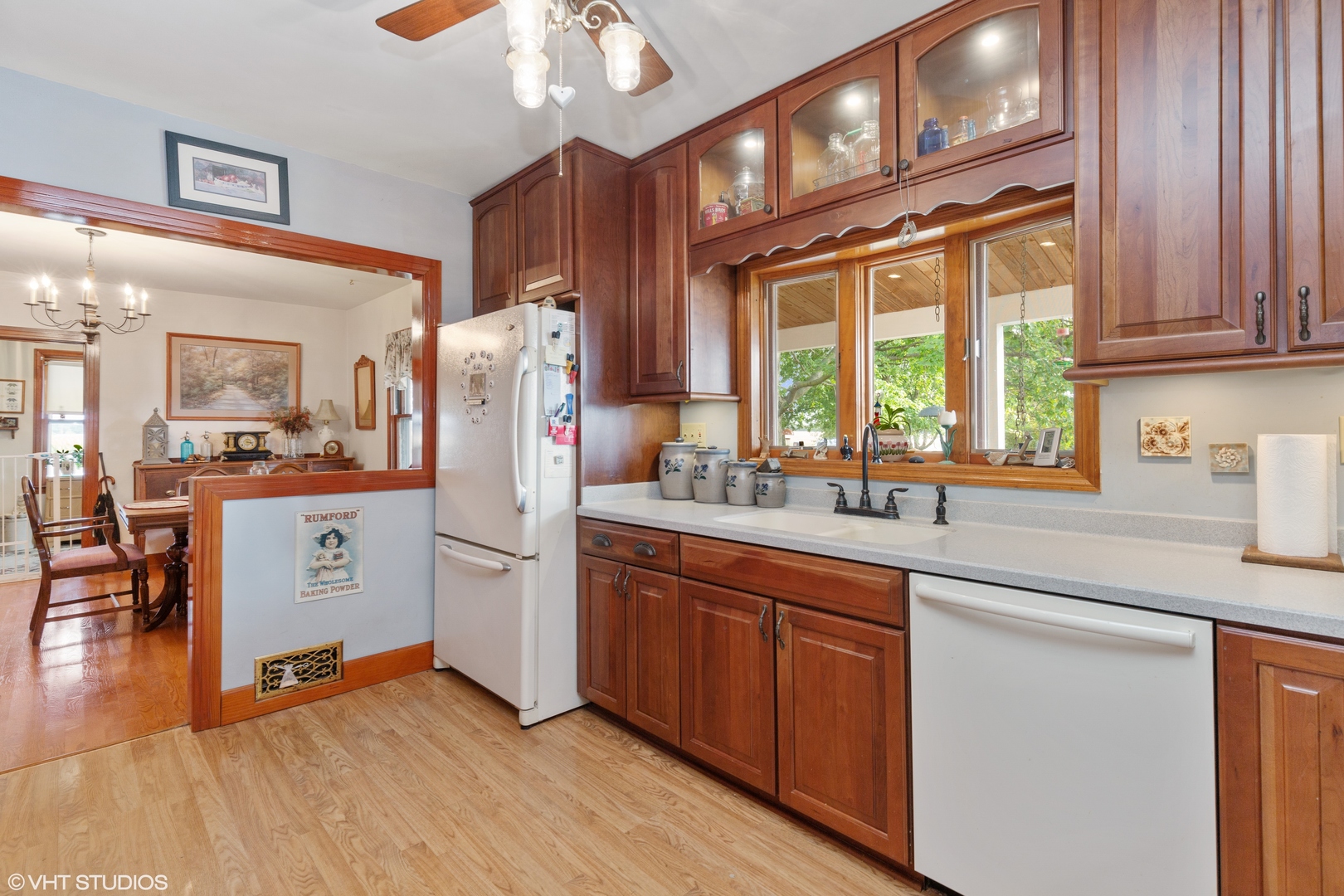 28573 Moose Range Road Sycamore, IL 60178 - Photo 27 of 52 a kitchen with stainless steel appliances granite countertop a refrigerator a sink dishwasher a stove and white countertops with wooden floor