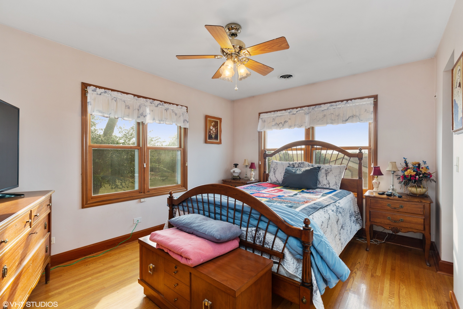 28573 Moose Range Road Sycamore, IL 60178 - Photo 35 of 52 a bedroom with a bed and wooden floor
