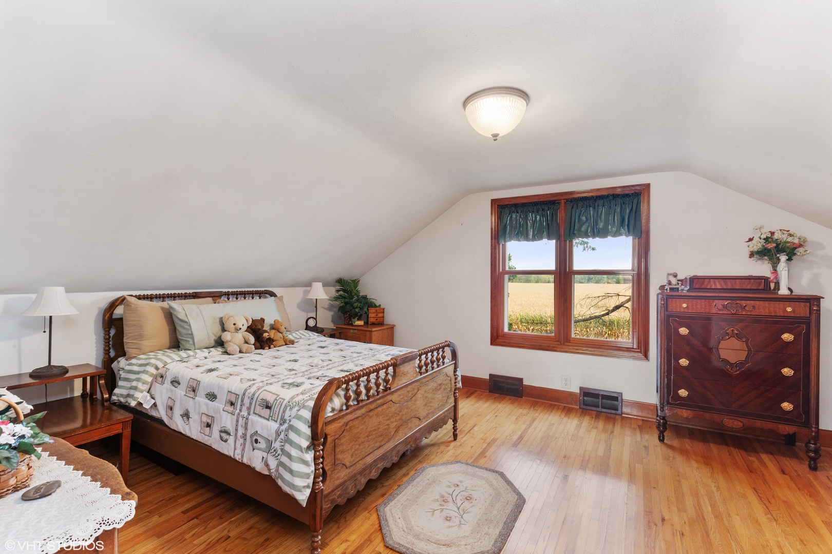 28573 Moose Range Road Sycamore, IL 60178 - Photo 37 of 52 a bedroom with a bed and wooden floor