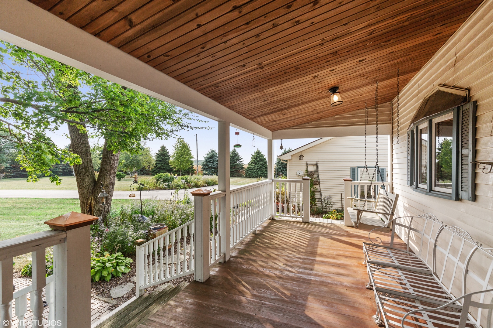 28573 Moose Range Road Sycamore, IL 60178 - Photo 46 of 52 a view of a porch with wooden floor and roof with a garden view