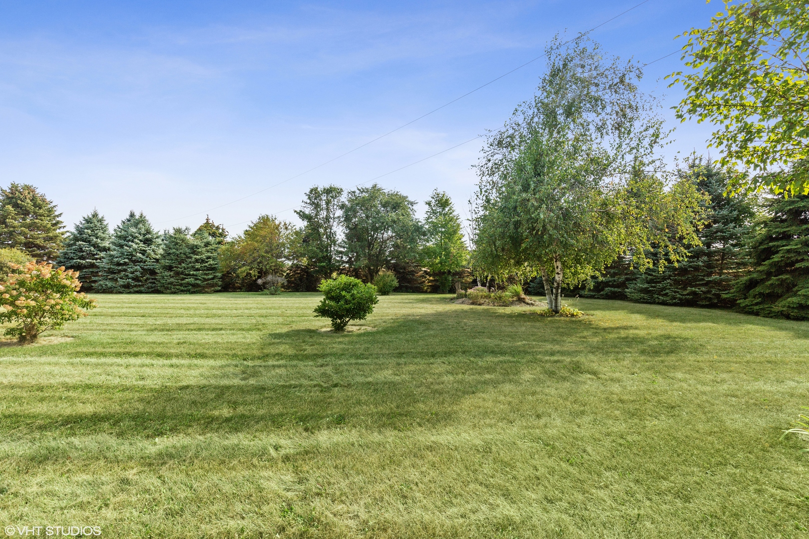 28573 Moose Range Road Sycamore, IL 60178 - Photo 7 of 52 a view of field with trees in the background