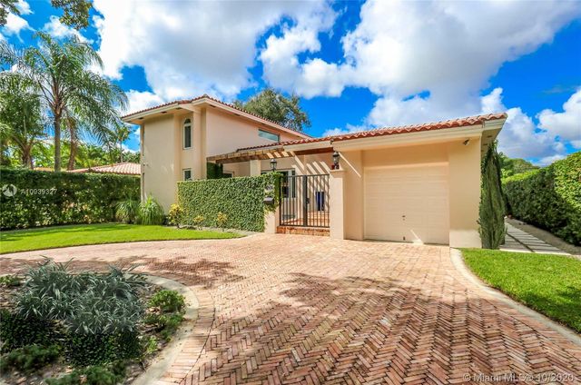a view of a backyard with a garden and plants