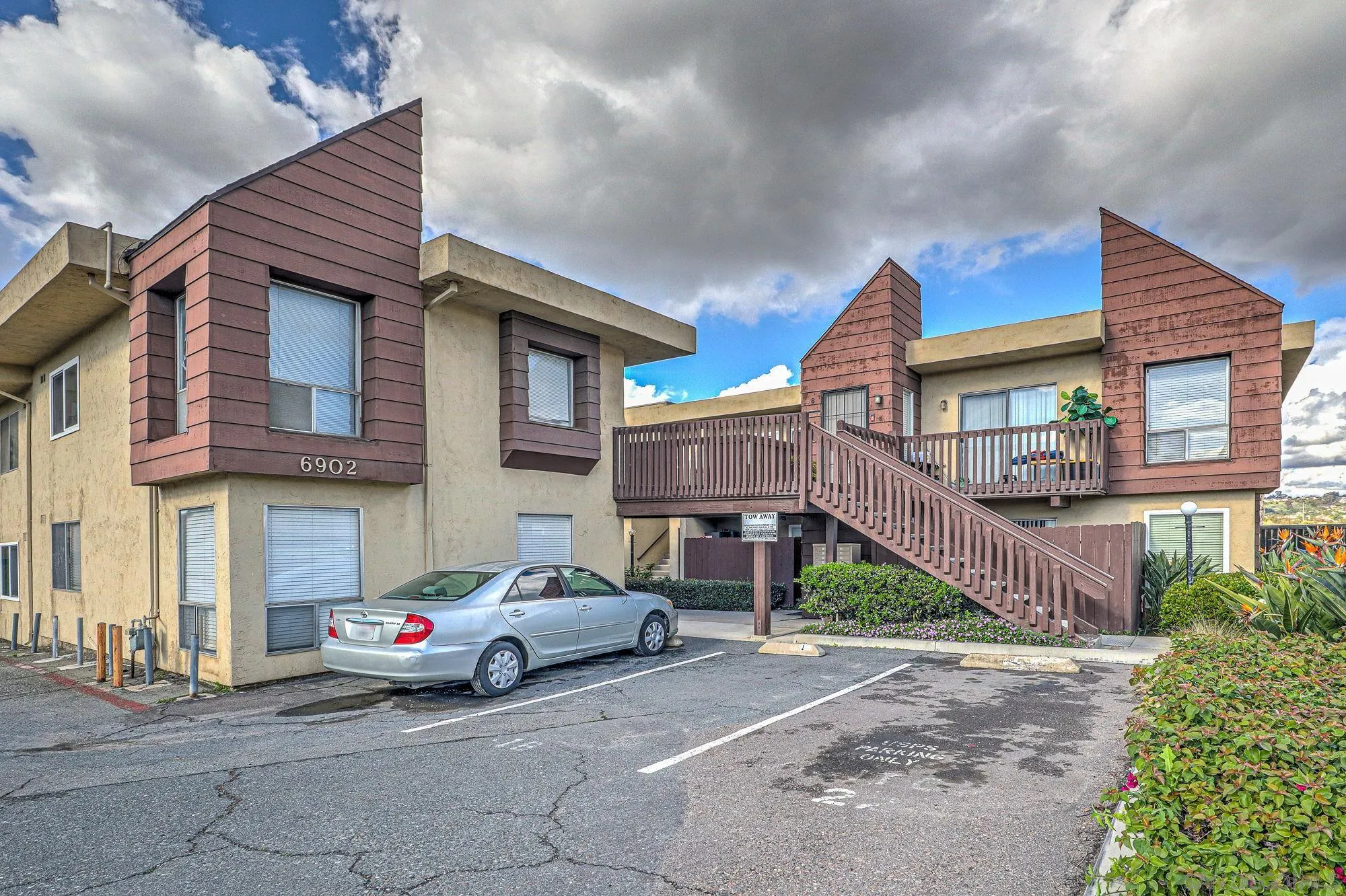 6902 Mission Gorge Road San Diego, CA 92120 - Photo 12 of 14 a car parked in front of a house
