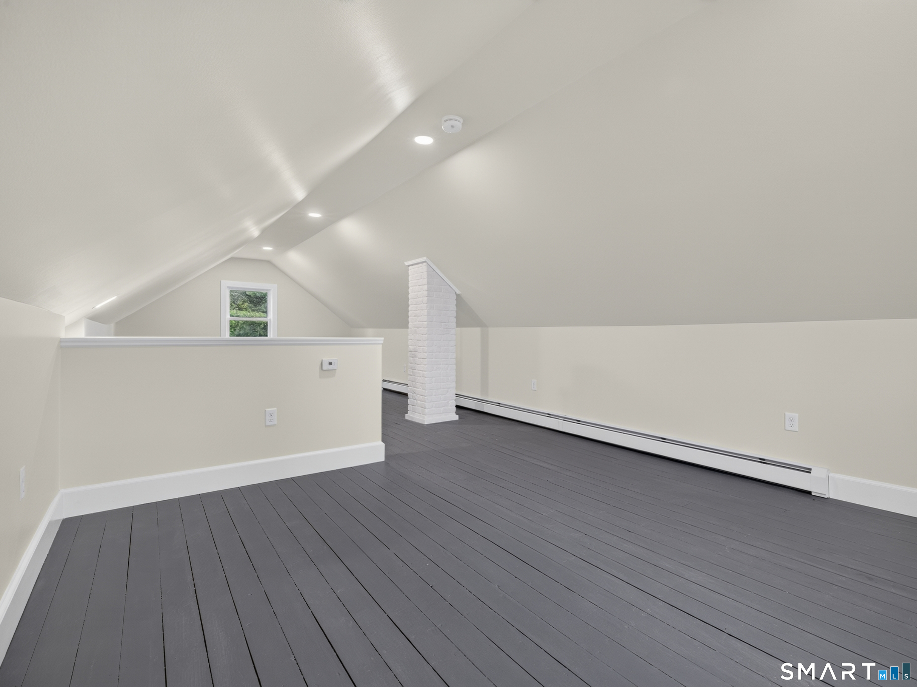 1039 N Road Groton, CT 06340 - Photo 17 of 26 a view of an empty room with wooden floor and a window